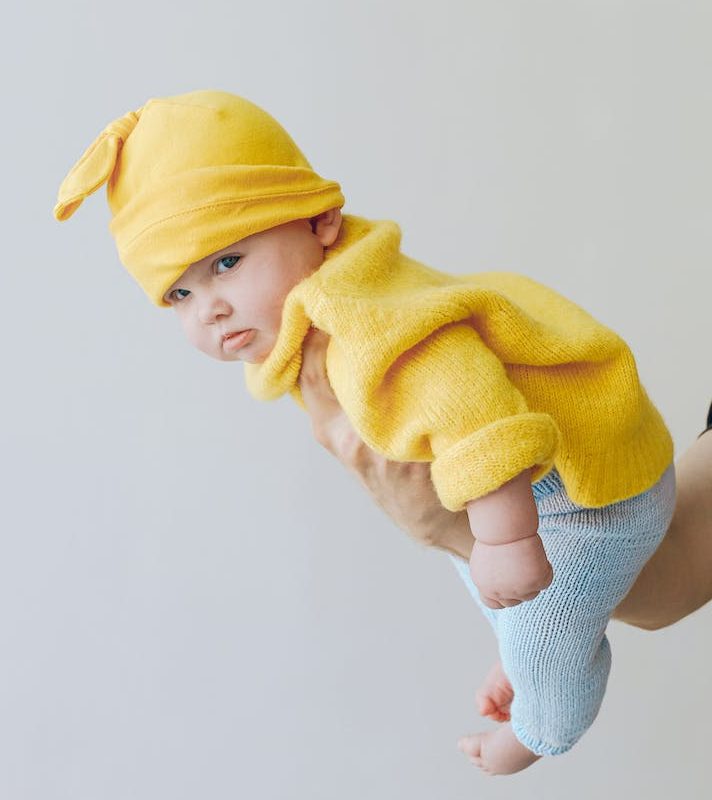 Child in Yellow Knit Cap and Yellow Sweater