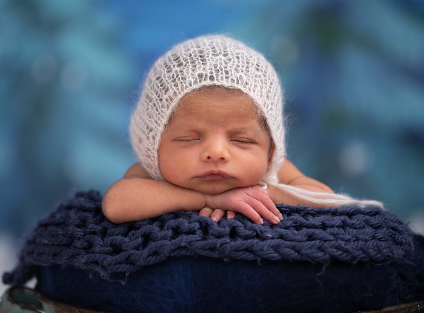 baby in white knit cap